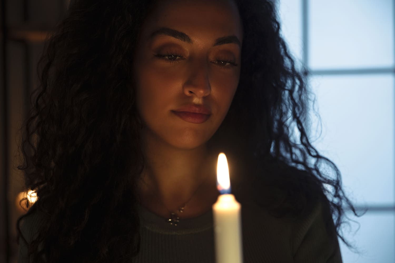 woman holding candle